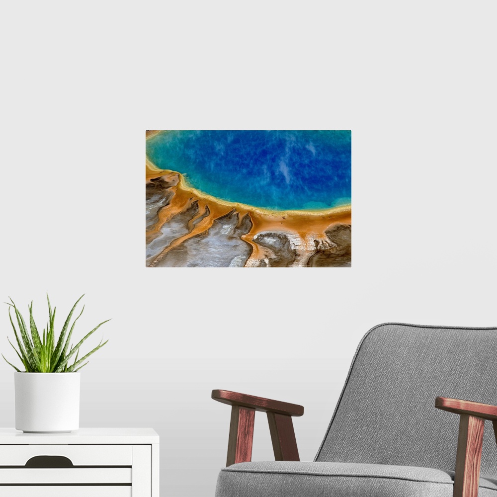 A modern room featuring Large image print of a spring  at Yellowstone National Park viewed from above.