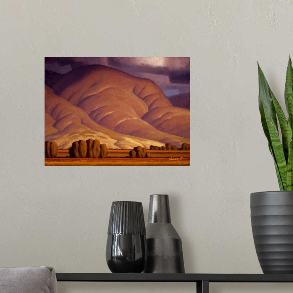 A modern room featuring Landscape painting of rolling Autumn hills with threatening snow clouds.