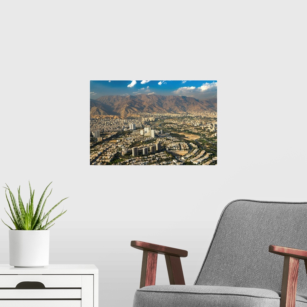A modern room featuring Aerial view of Tehran facing North towards the Alborz Mountains, Tehran, Iran, Middle East