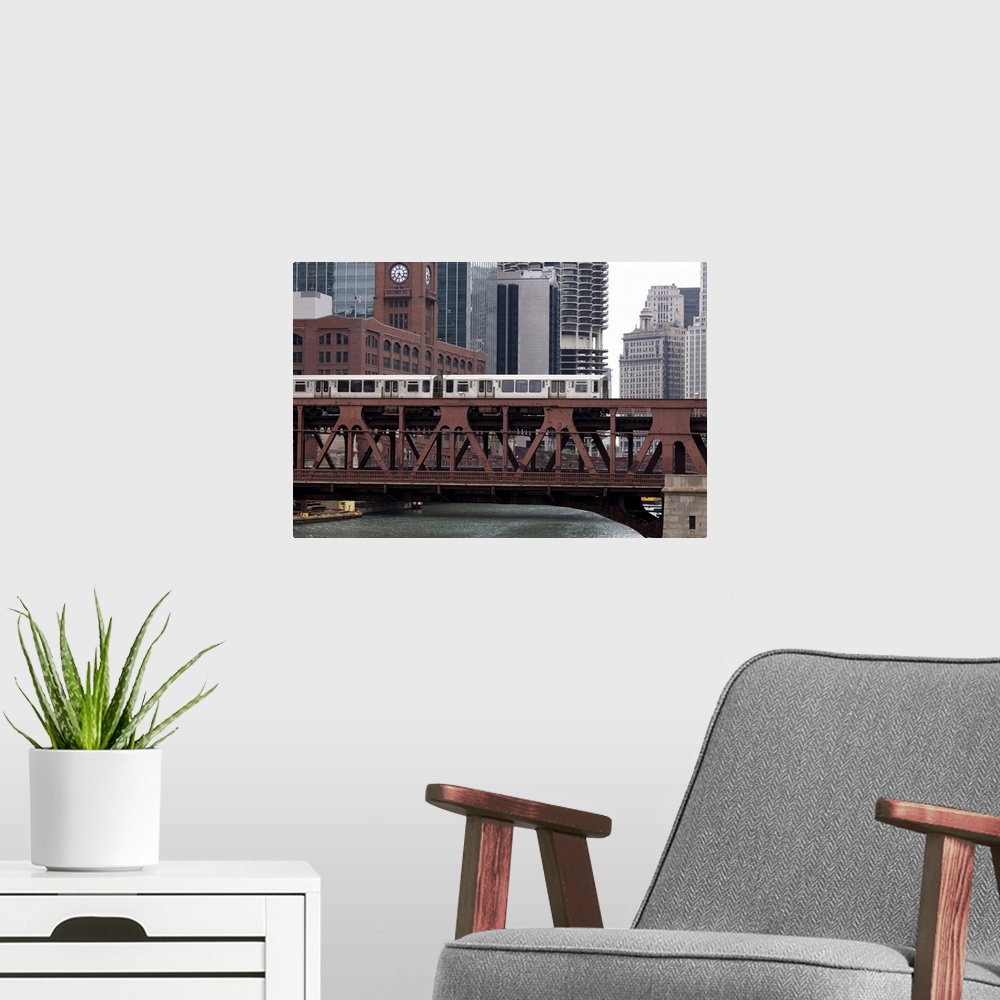 A modern room featuring An El train on the elevated train system crossing Wells Street Bridge, Chicago, Illinois, United ...