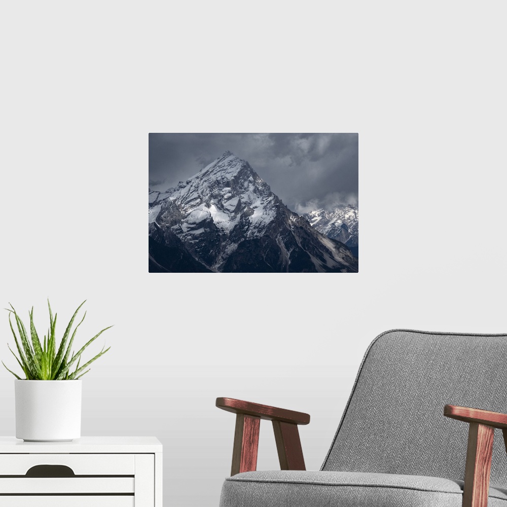 A modern room featuring Averau mountain covered by snow and with light rays filtering through clouds, Dolomites, Belluno,...