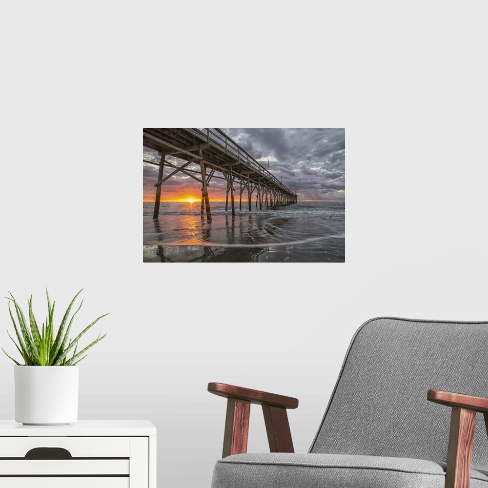 A modern room featuring Beach, ocean, waves and pier at sunrise, Sunset Beach, North Carolina, United States of America, ...