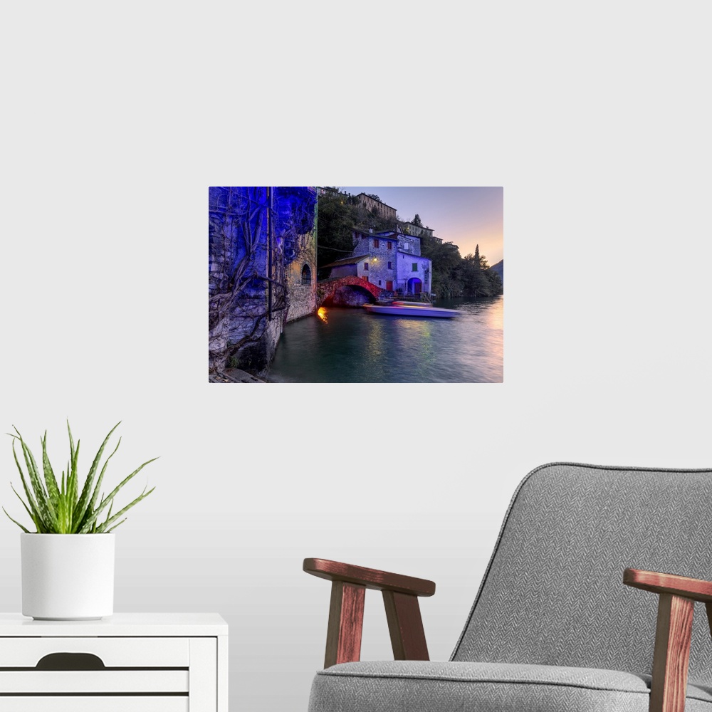 A modern room featuring Boat in motion under the illuminated Nesso bridge, Lake Como, Lombardy, Italian Lakes, Italy, Europe