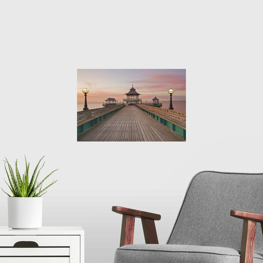 A modern room featuring A dusk view of Clevedon Pier, in Clevedon, on the Bristol Channel coast of Somerset, England, Uni...