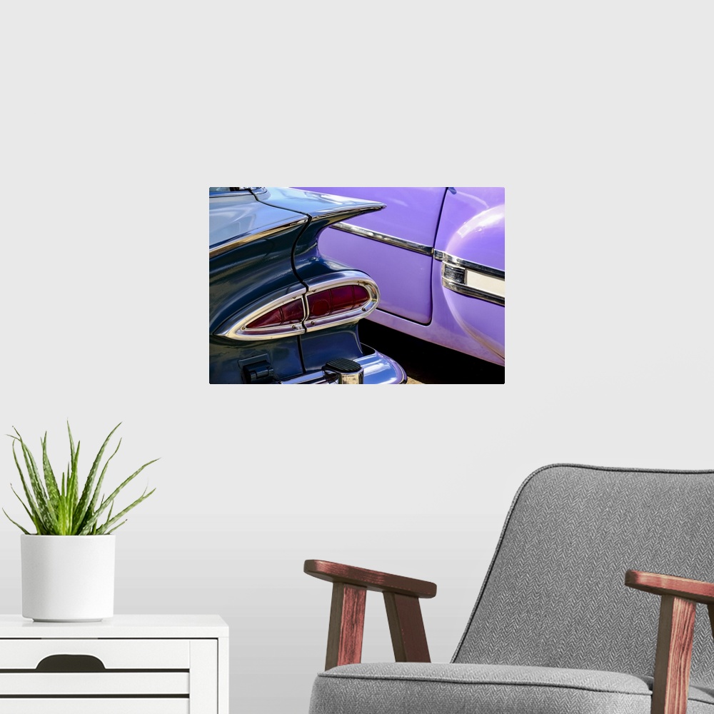 A modern room featuring Close-up view of two colorful vintage cars, Havana, Cuba, West Indies, Central America