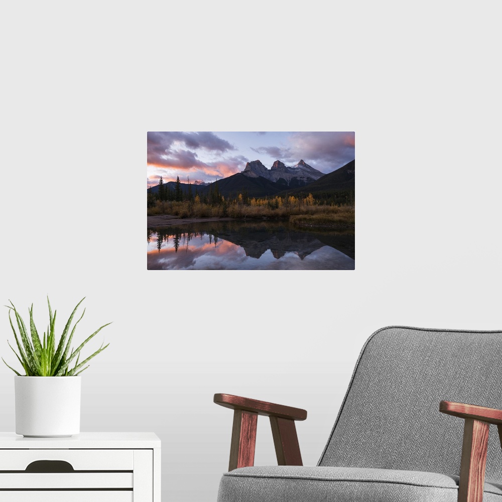 A modern room featuring Colourful sunrise over Three Sisters at Policeman Creek in autumn, Canmore, Banff, Alberta, Canad...