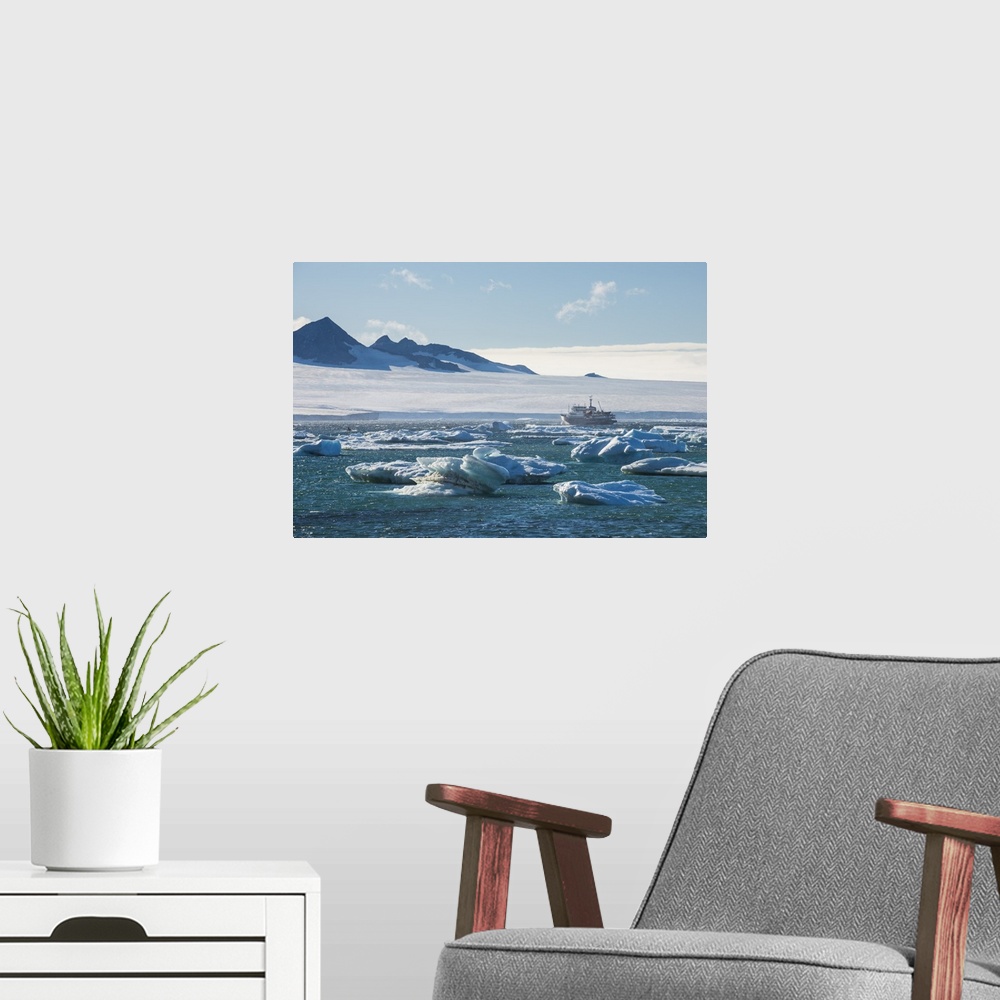 A modern room featuring Cruise ship behind icebergs, Brown Bluff, Tabarin Peninsula, Antarctica, Polar Regions