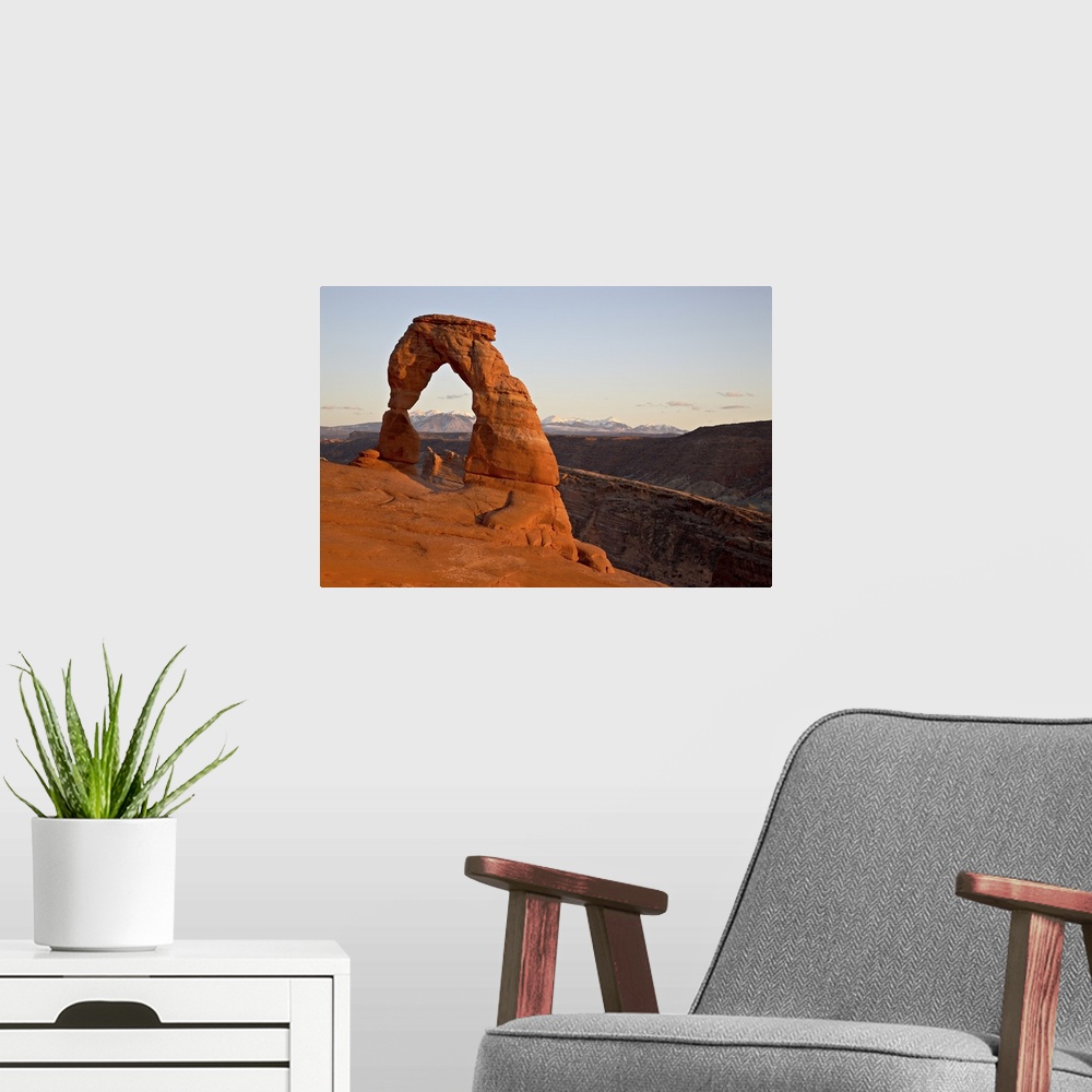 A modern room featuring Delicate Arch at sunset, Arches National Park, Utah