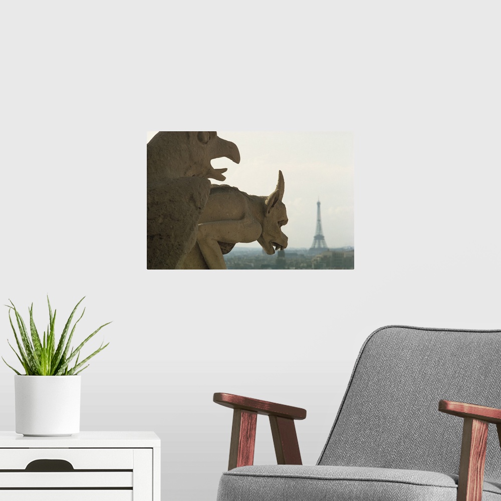 A modern room featuring Gargoyles on Notre Dame Cathedral, and beyond, the Eiffel Tower, Paris, France, Europe