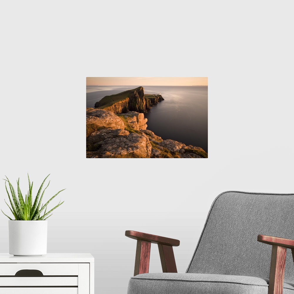 A modern room featuring Neist Point and Lighthouse bathed in evening light, Isle of Skye, Highland, Scotland