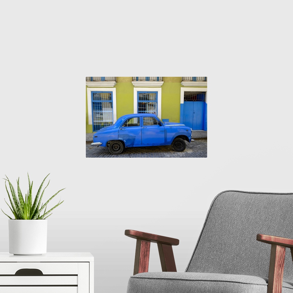 A modern room featuring Old car parked in front of a colorful building, Old Havana, Cuba, West Indies, Central America