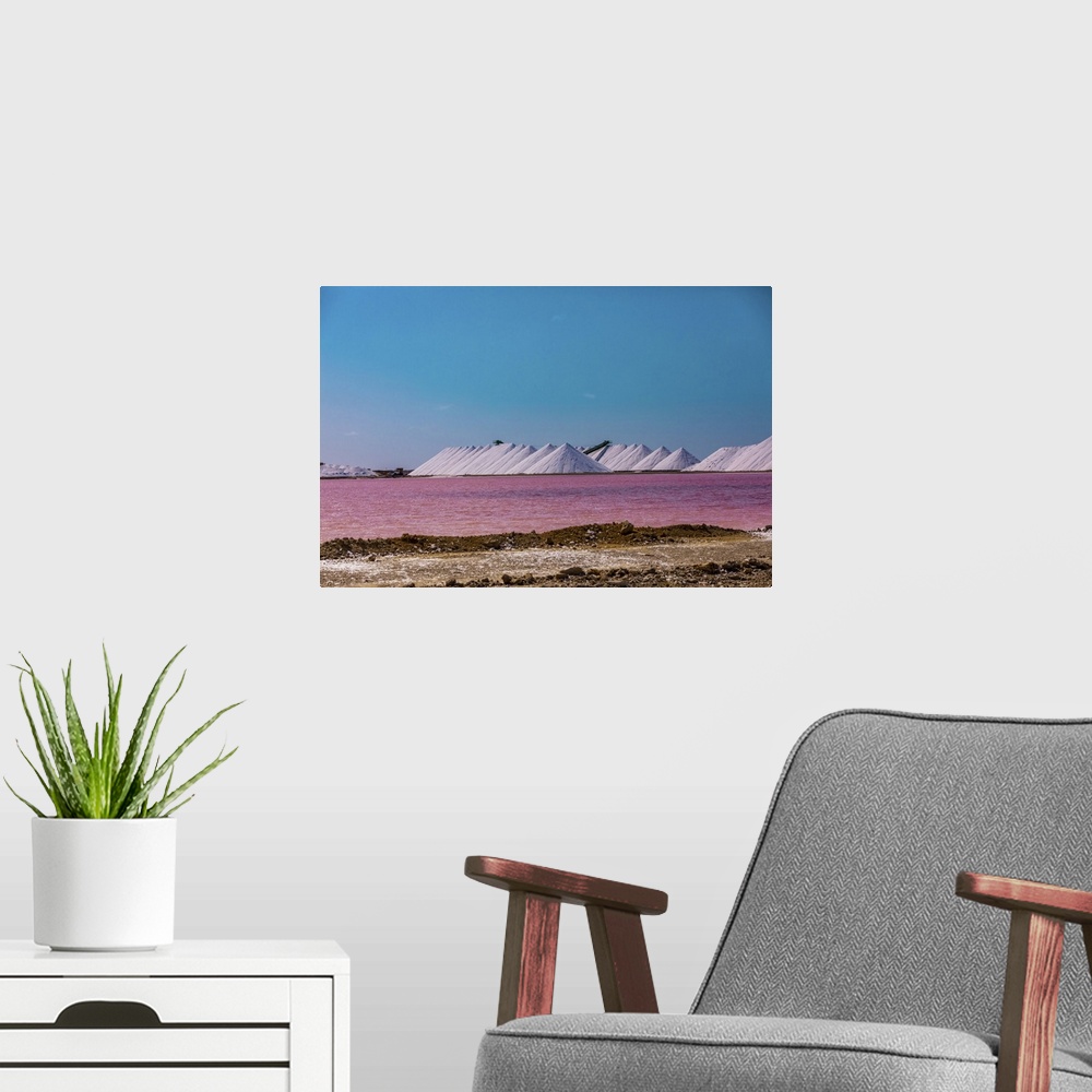 A modern room featuring View of the pink colored ocean overlooking the Salt Pyramids of Bonaire from afar, Bonaire, Nethe...