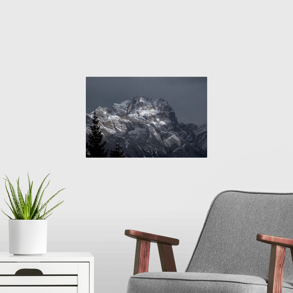 A modern room featuring Pomagagnon mountain covered by pristine snow on a cloudy day, Dolomites, Belluno, Veneto, Italy, ...