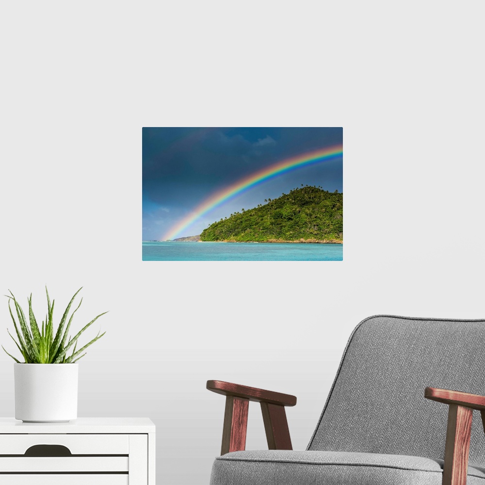 A modern room featuring Rainbow over an islet off Ofu Island, Manua Island group, American Samoa