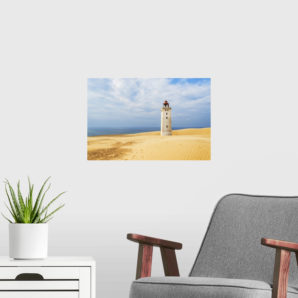 A modern room featuring Rubjerg Knude lighthouse surrounded by sand dunes, Jutland, Denmark, Europe
