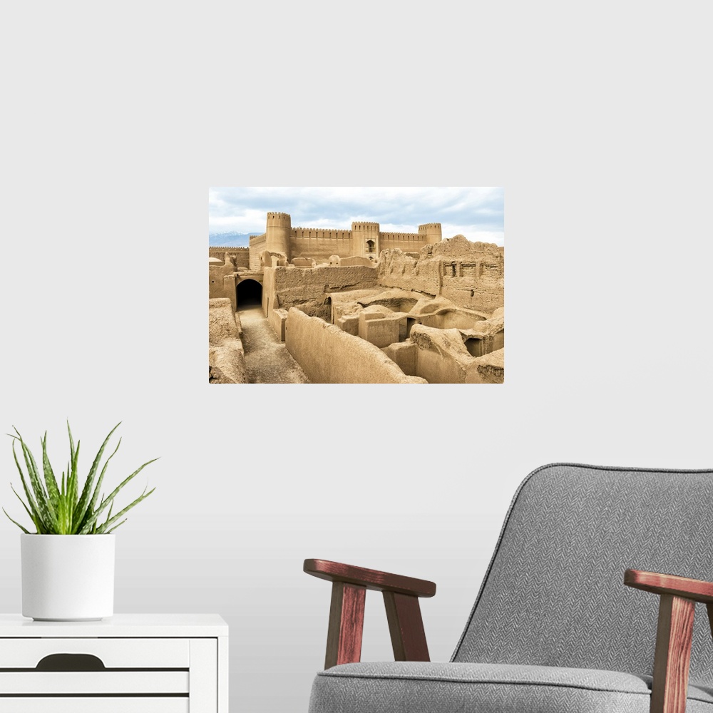 A modern room featuring Ruins, towers and walls of Rayen Citadel, biggest adobe building in the world, Rayen, Kerman Prov...