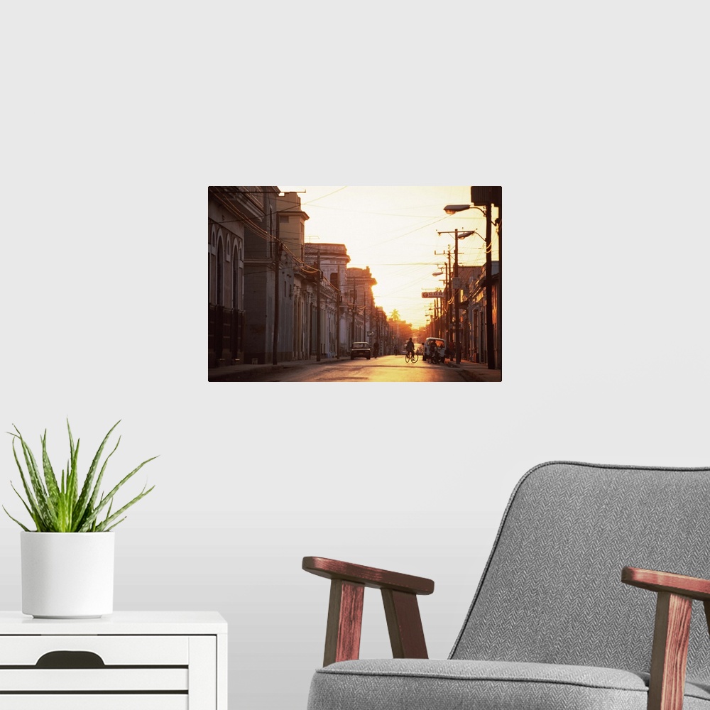 A modern room featuring Street scene at sunrise, Cienfuegos, Cuba, West Indies, Central America