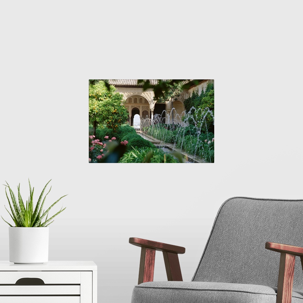 A modern room featuring The Canal Court of the Generalife gardens in May, Granada, Andalucia, Spain