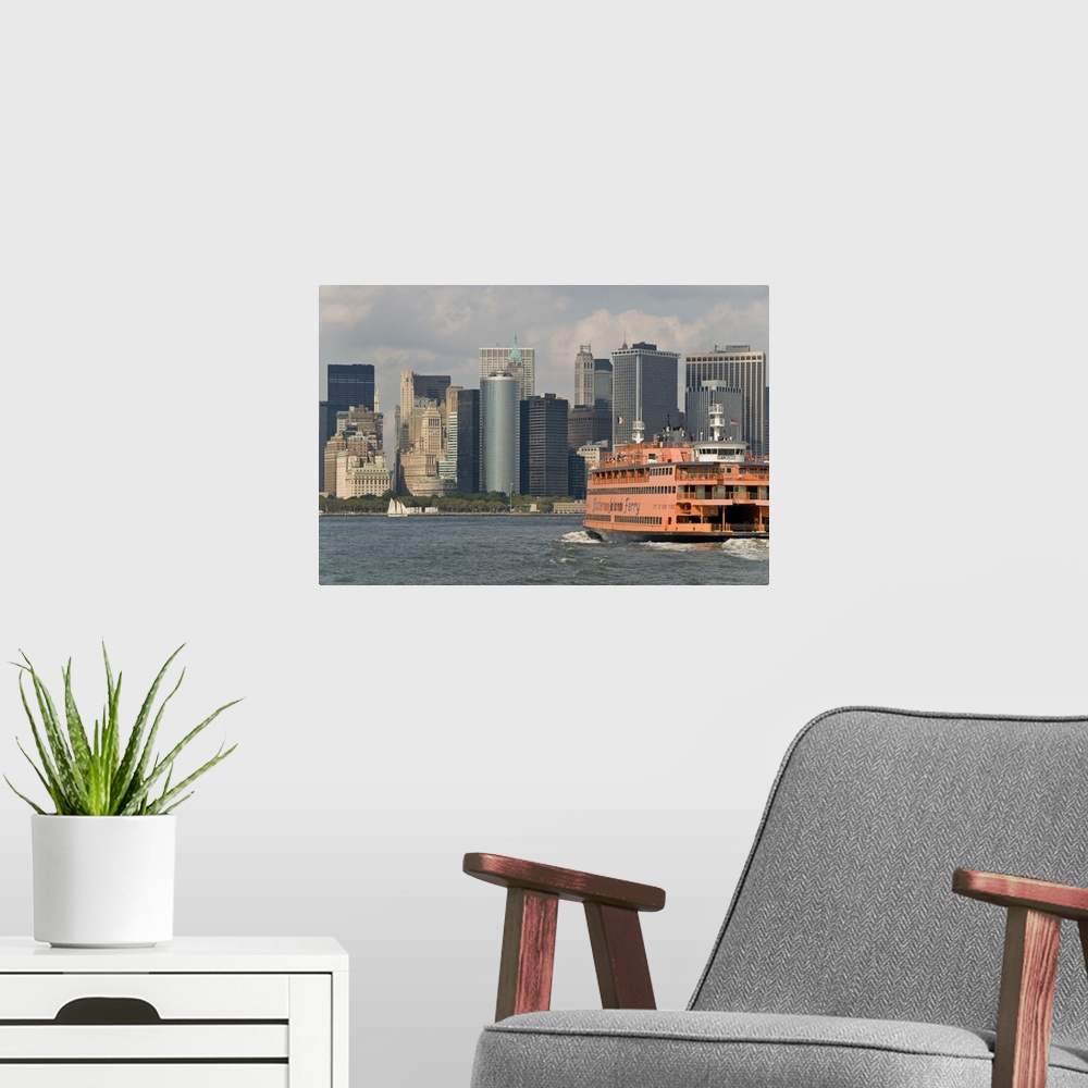 A modern room featuring The famous orange Staten Island Ferry approaches lower Manhattan, New York