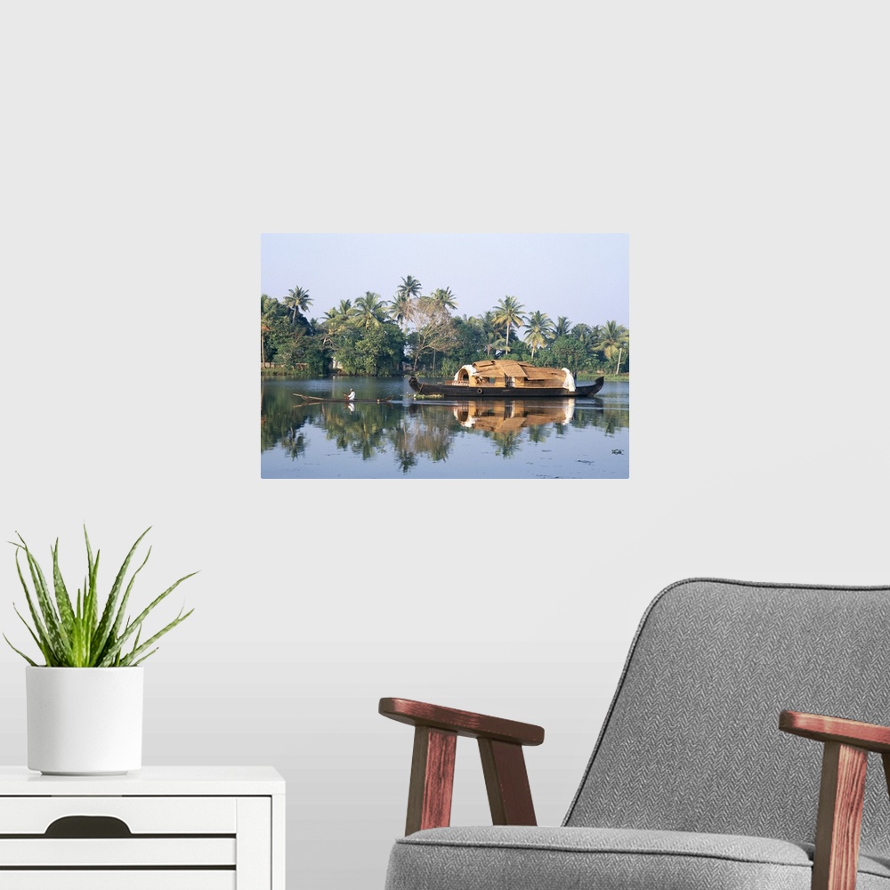 A modern room featuring Tourists' rice boat on the backwaters near Kayamkulam, Kerala, India, Asia