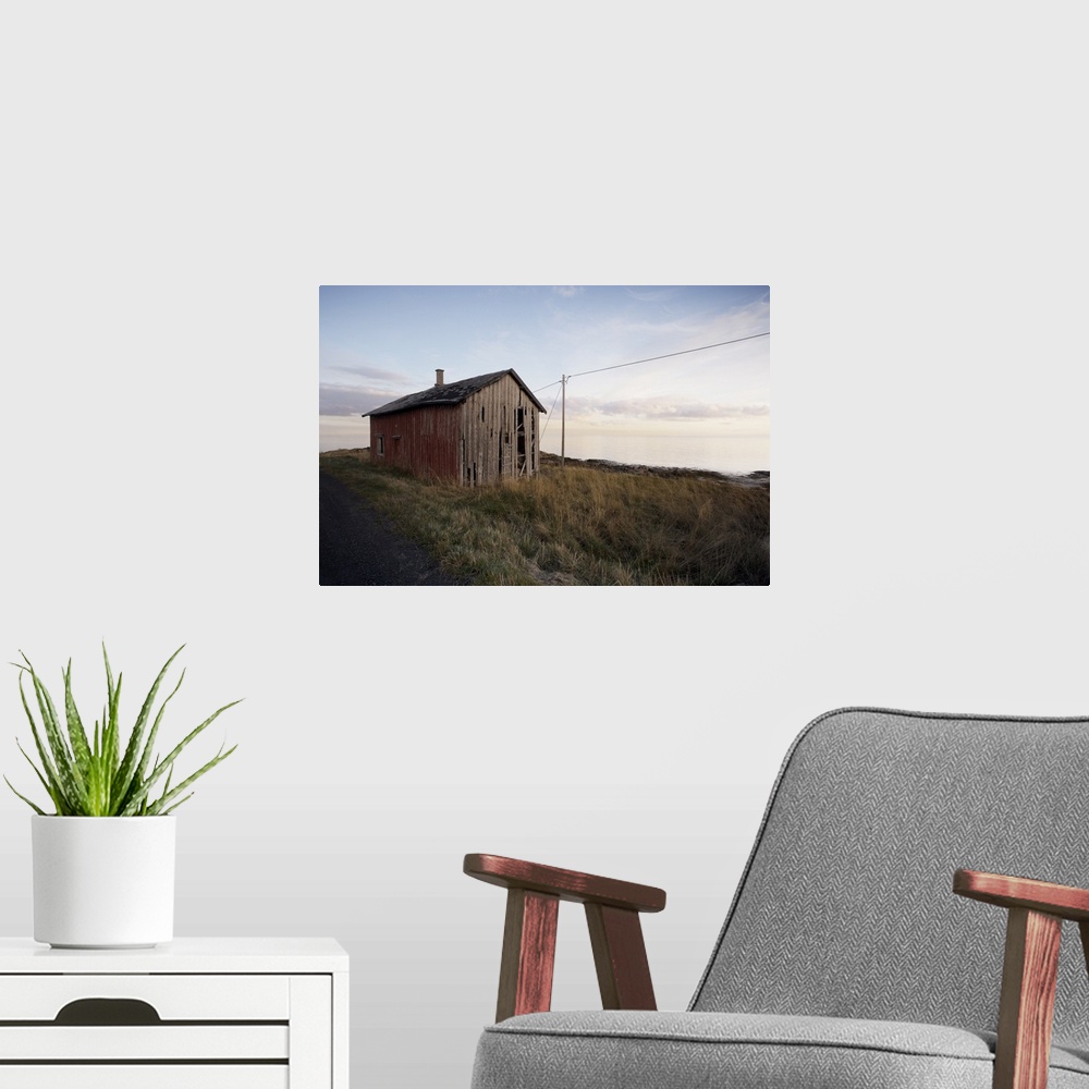 A modern room featuring Weathered barn on coast, Lofoten Islands, Norway, Scandinavia, Europe