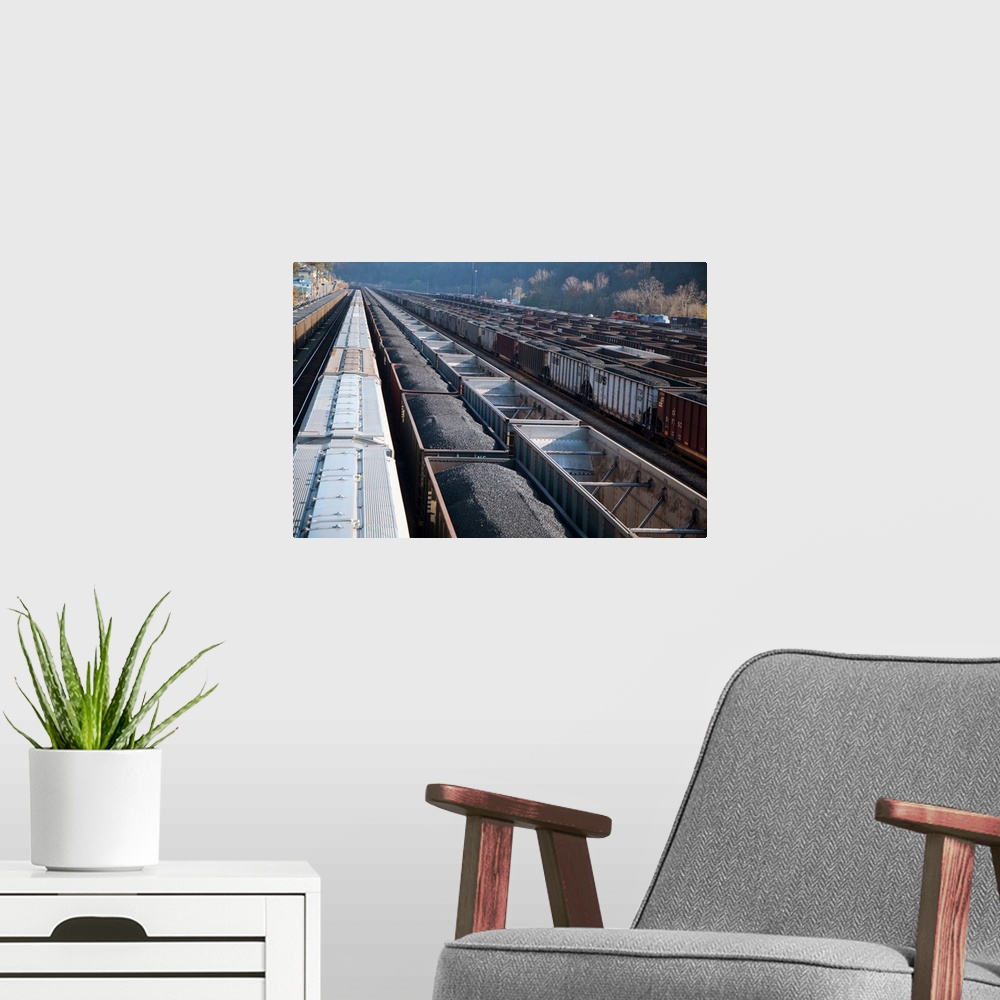 A modern room featuring Freight trains carrying coal in a railway yard. Williamson, West Virginia