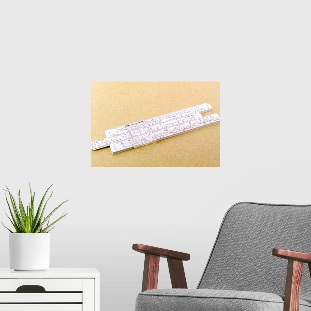 A modern room featuring Logarithmic slide rule. This adjustable ruler contains the values for logs, which are used to aid...