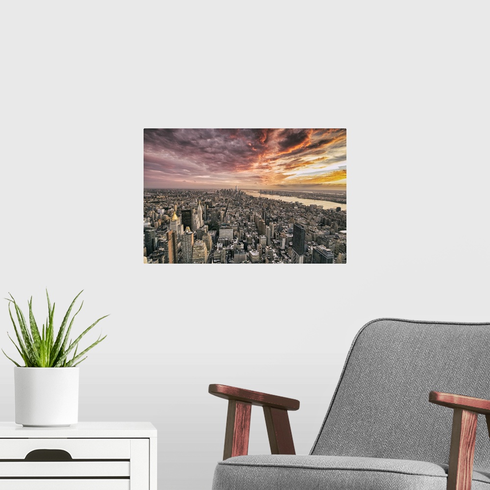 A modern room featuring Beautiful sunset with clouds from the Empire State Building.