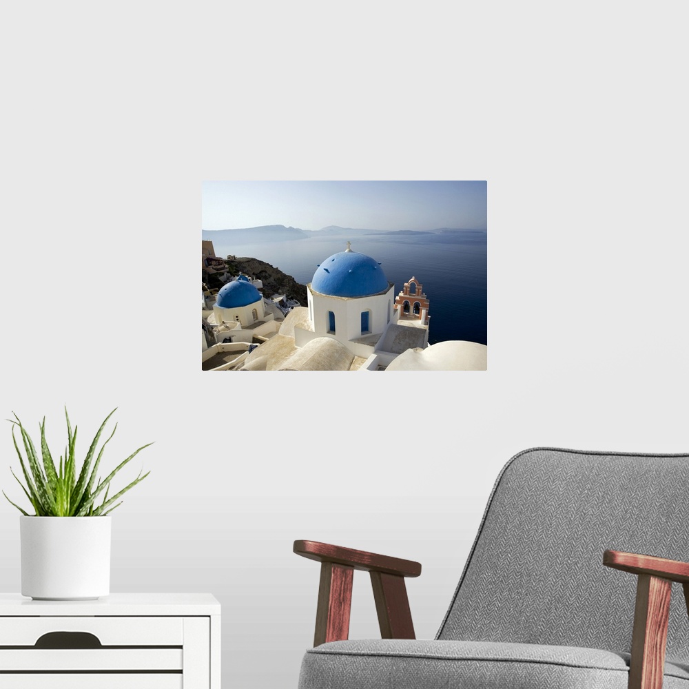 A modern room featuring Photograph taken on the coast of Greece looking out toward the water with blue domed churches sit...