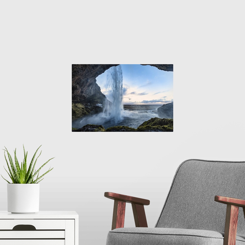 A modern room featuring Seljalandsfoss waterfall in south Iceland.