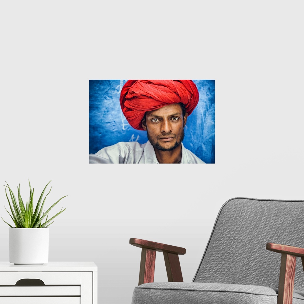 A modern room featuring Man with red turban in the Blue City of Jodhpur, India.