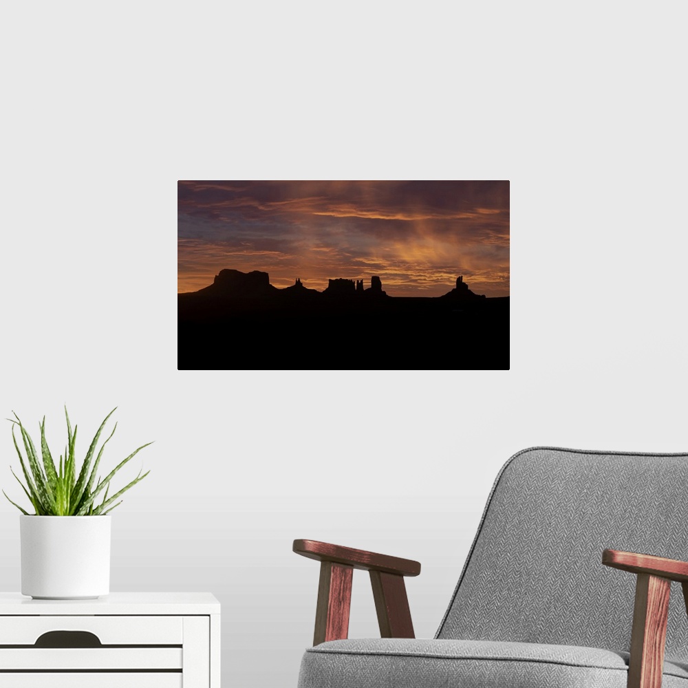 A modern room featuring Monument Valley at sunrise