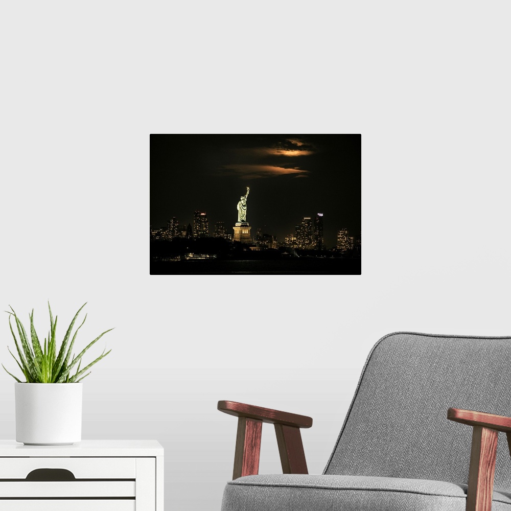 A modern room featuring Moonrise over the Stature of Liberty in New York City