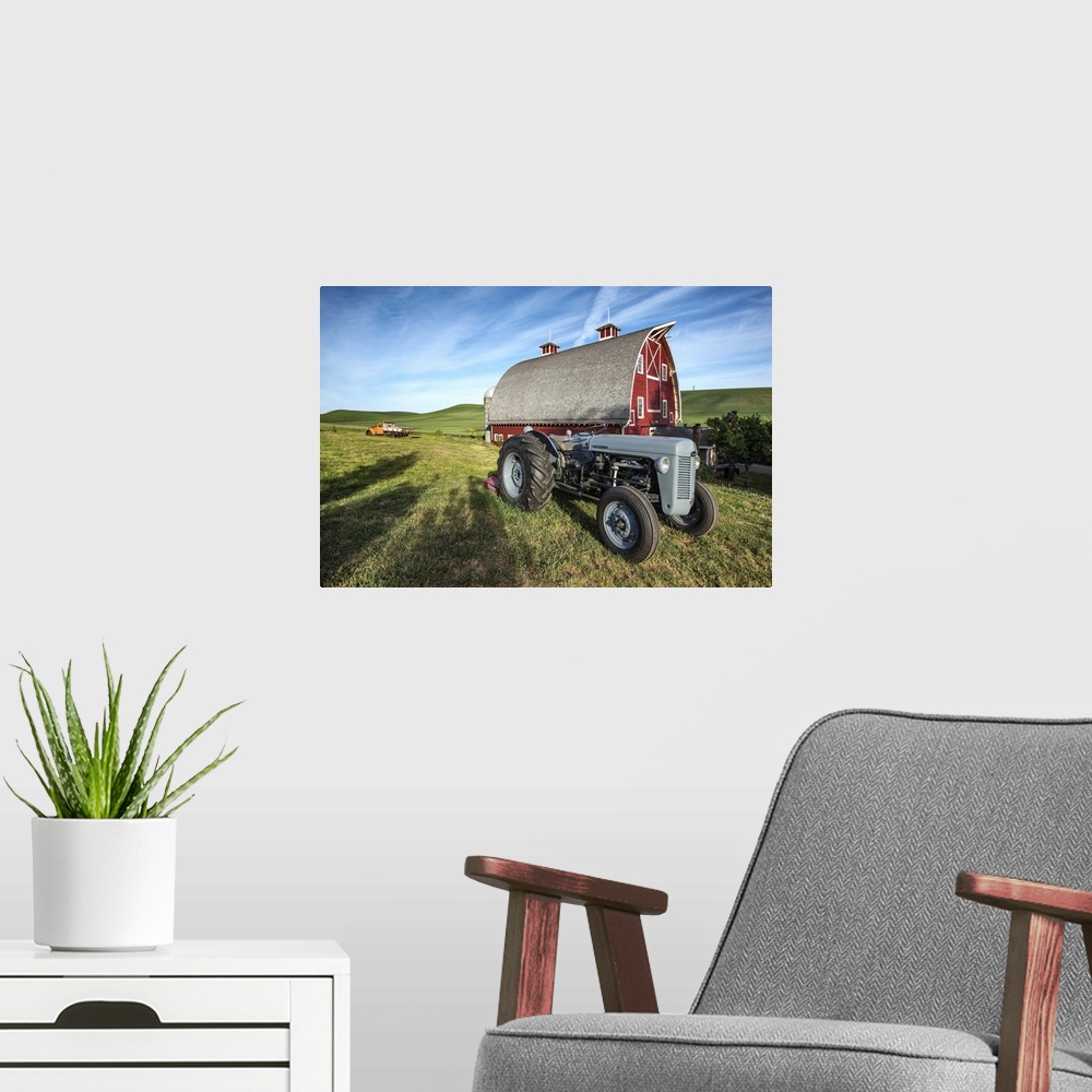 A modern room featuring Old tractor and red barn in the Palouse, Washington