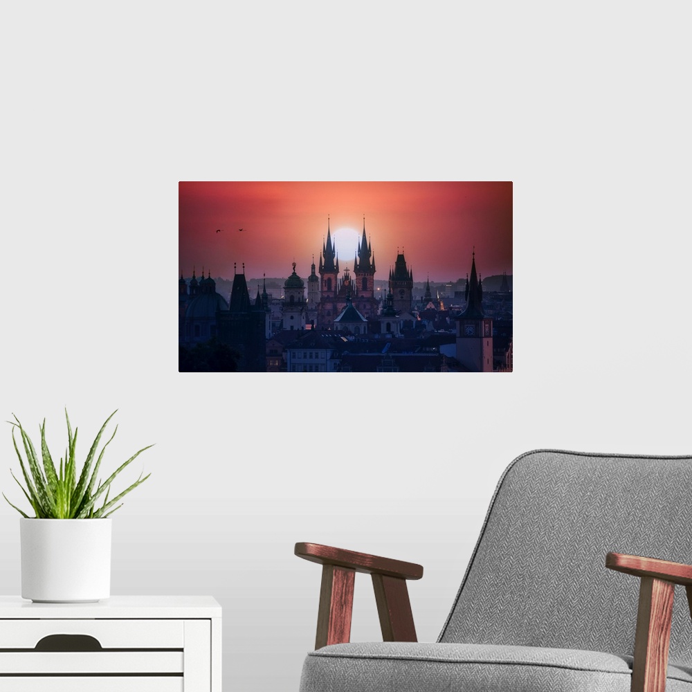 A modern room featuring The towers of beautiful Prague at sunrise.