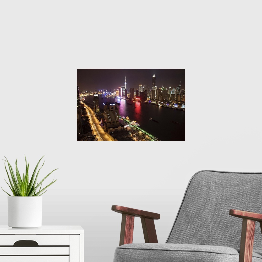 A modern room featuring Skyline above the Bund and Pudong at night, Shanghai, China