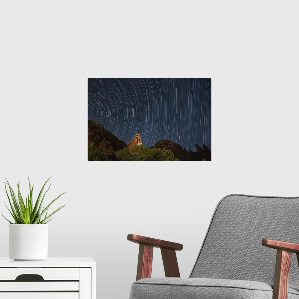 A modern room featuring Star trails above the Chapel of the Holy Cross in Sedona, Arizona