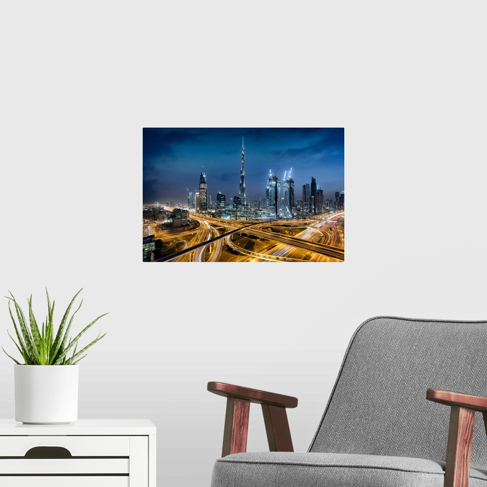 A modern room featuring The Burj Khalifa and massive interchange of Dubai.