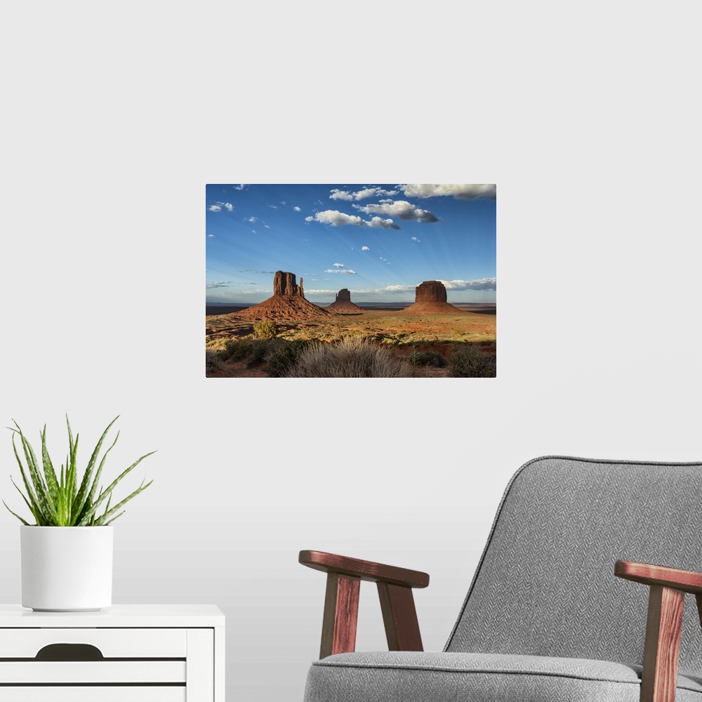 A modern room featuring The MIttens at sunset in Monument Valley, Utah