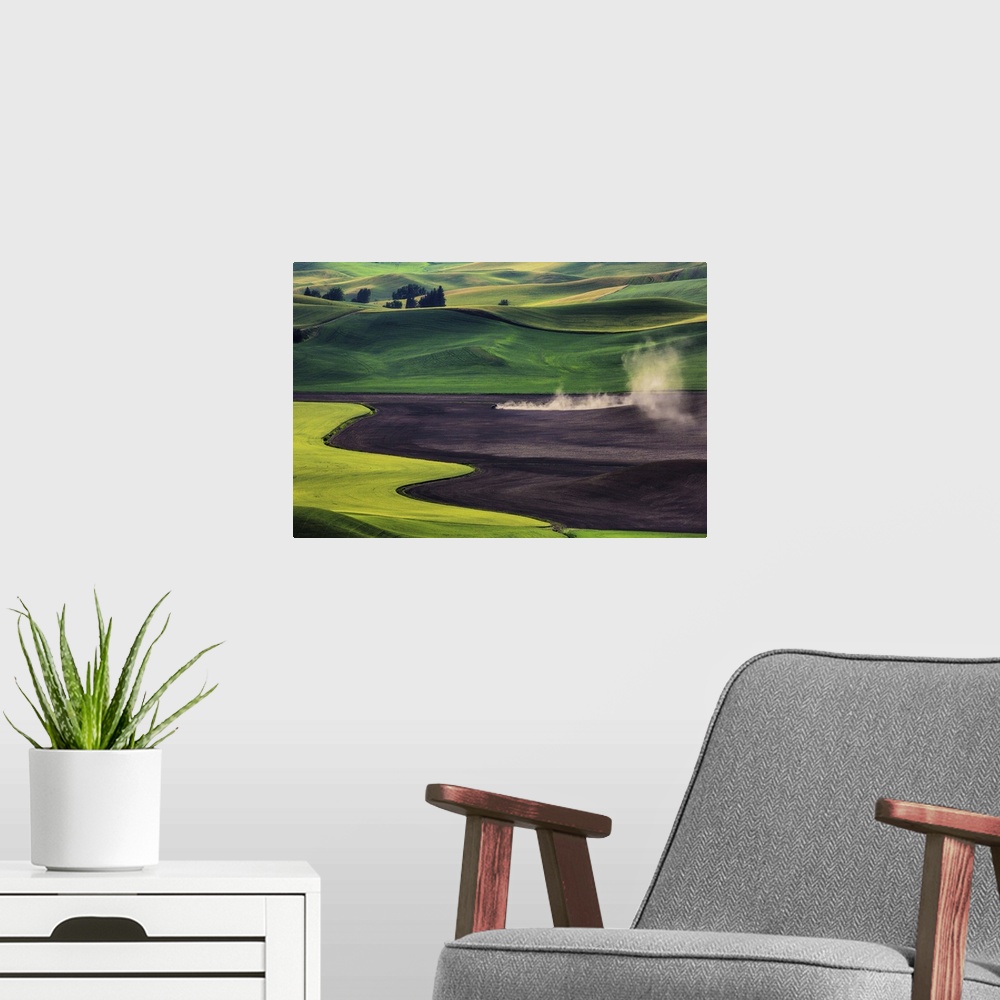 A modern room featuring Tractor working in the wheat fields of the Palouse, Washington.