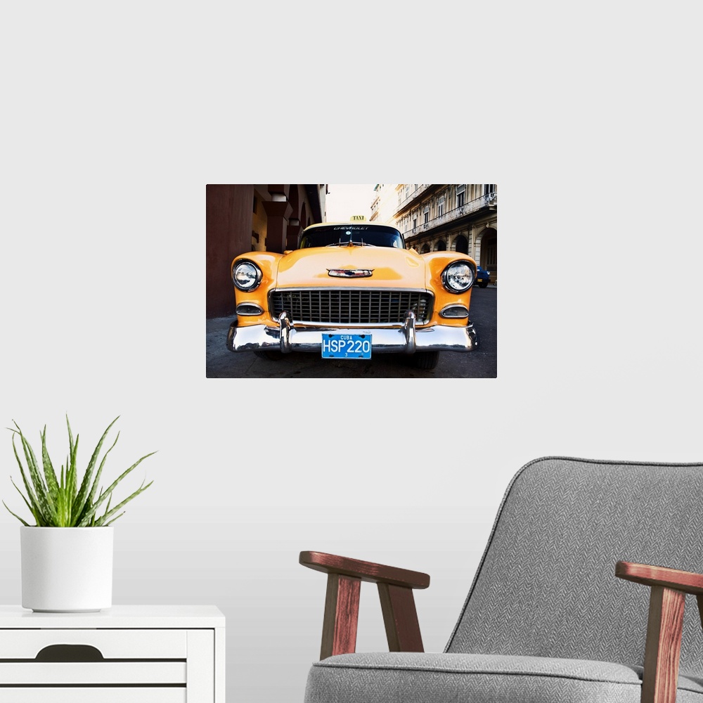 A modern room featuring Vintage Chevrolet taxi in Cuba