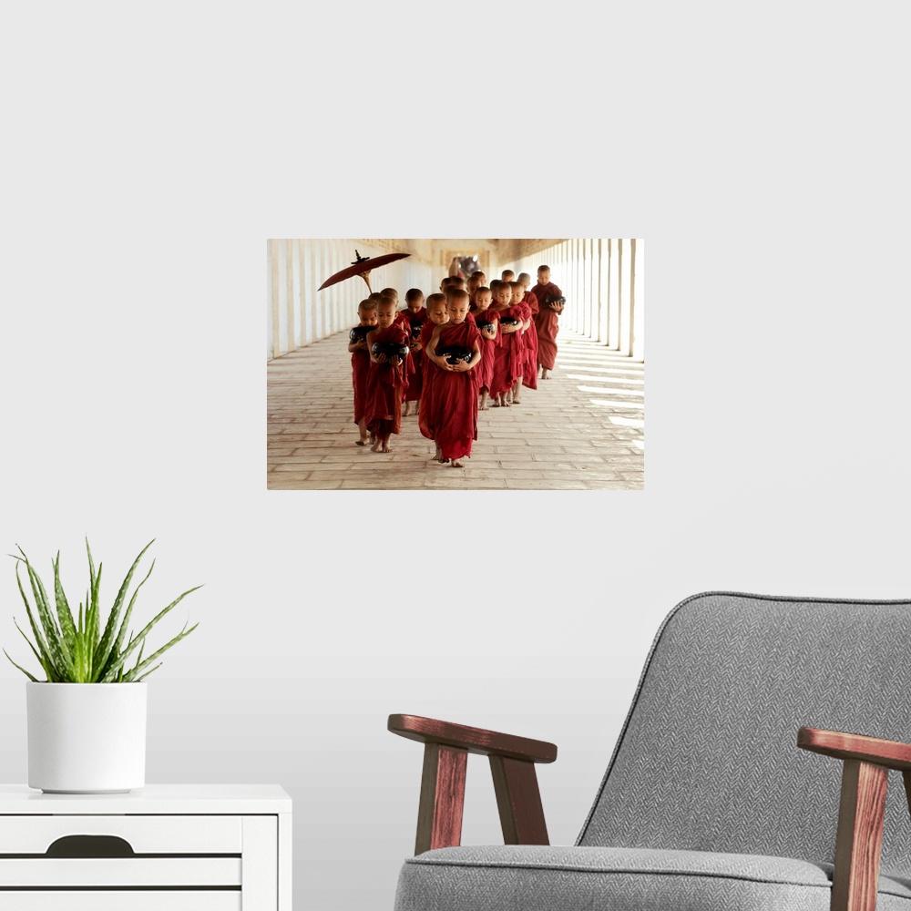 A modern room featuring Young monks walking in their monastery, Bagan, Burma