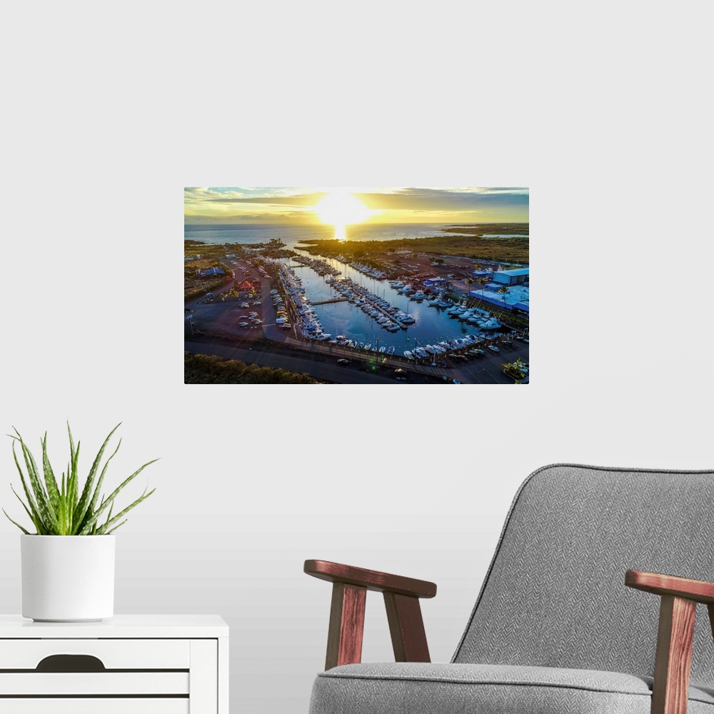 A modern room featuring Aerial photograph of the Kona Marina, Hawaii, at sunset