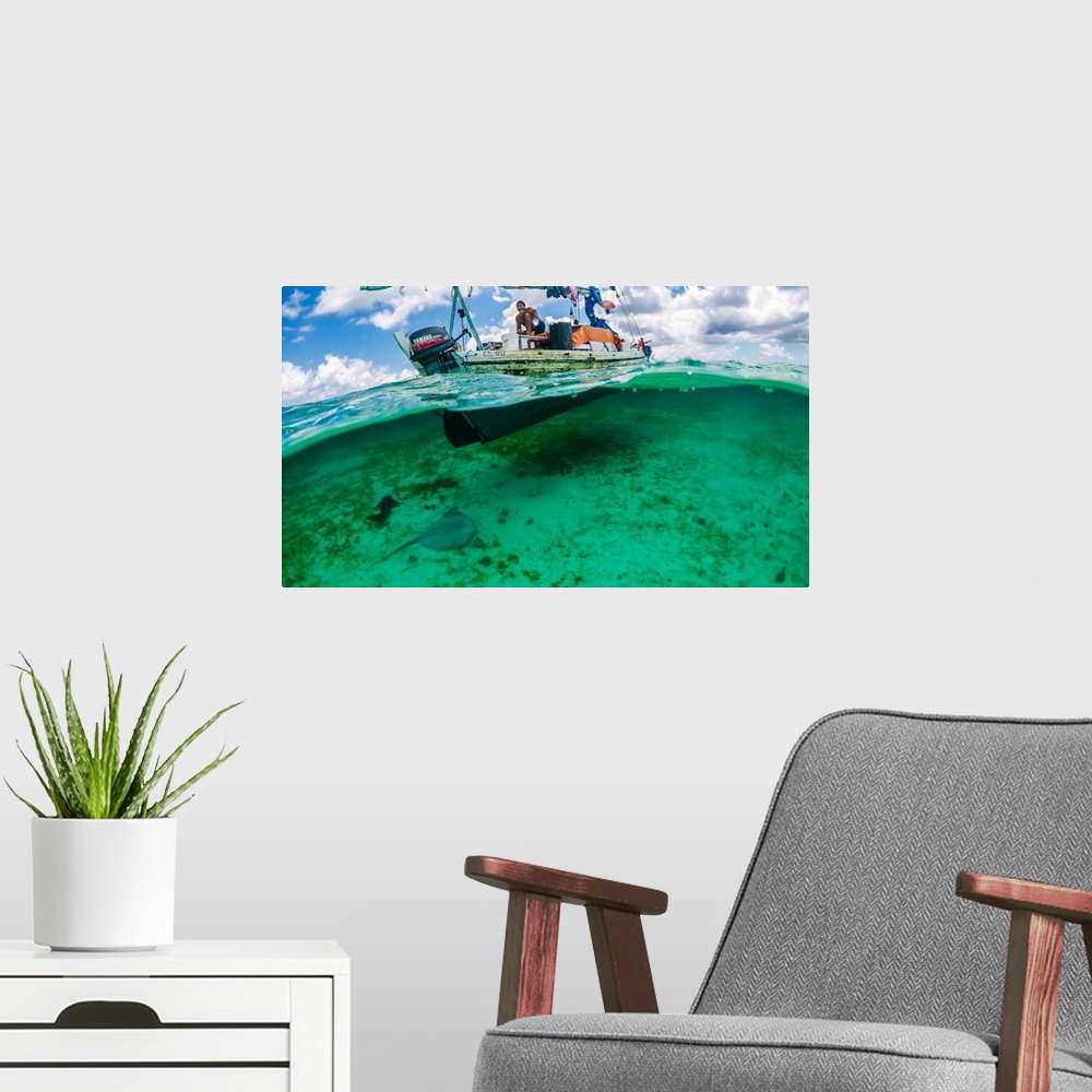 A modern room featuring Gypsy Fisherman on the clear water of Southern Belize