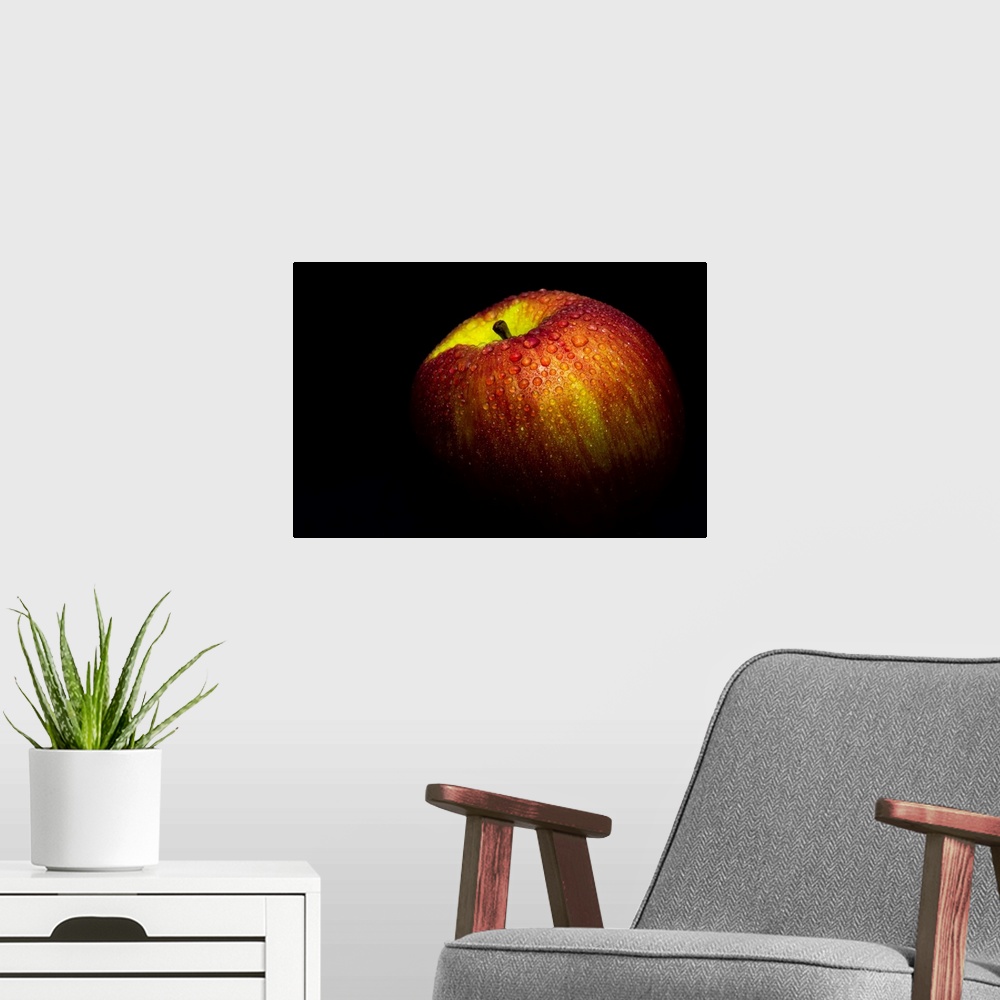 A modern room featuring A close up photograph of a fresh Gala apple with waterdrops.