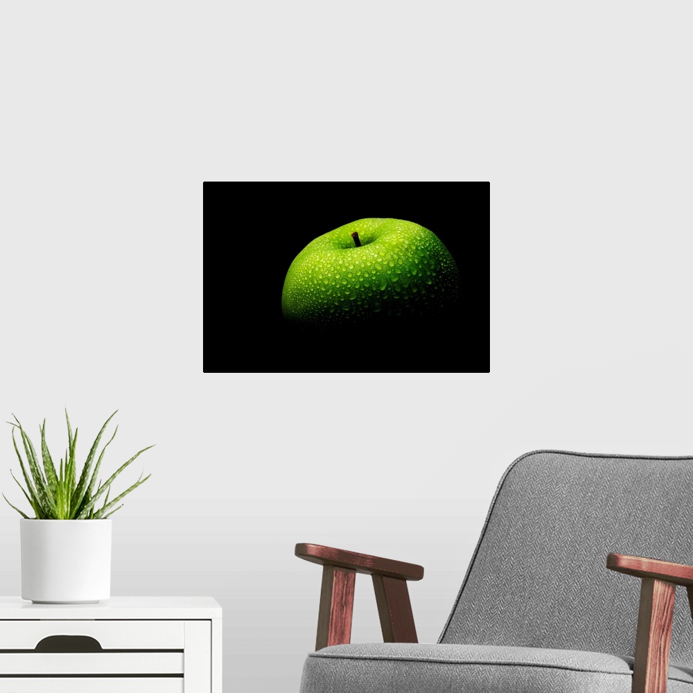 A modern room featuring A close up photograph of a fresh Granny Smith apple with waterdrops.