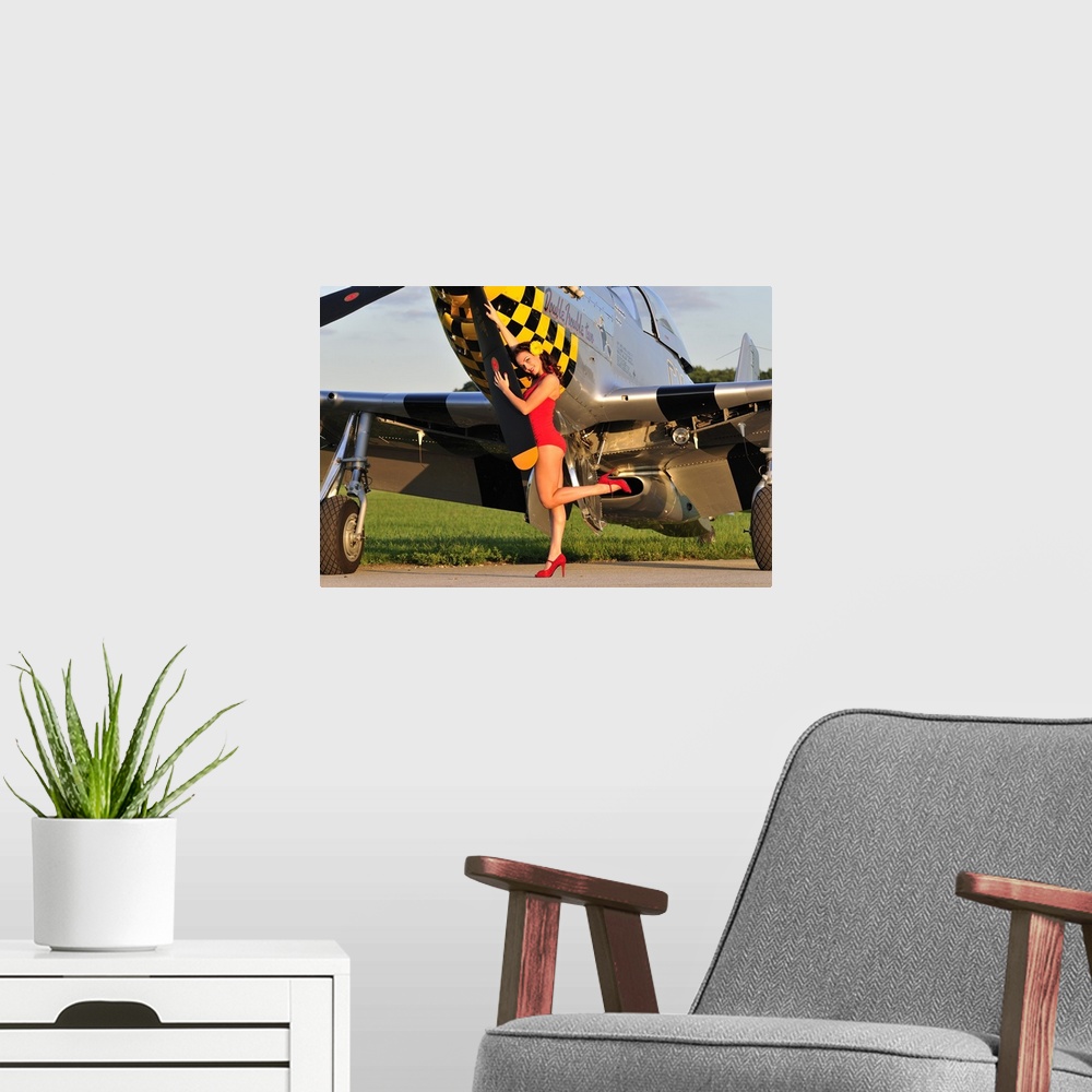 A modern room featuring Sexy 1940's style pin-up girl posing with a P-51 Mustang fighter plane.
