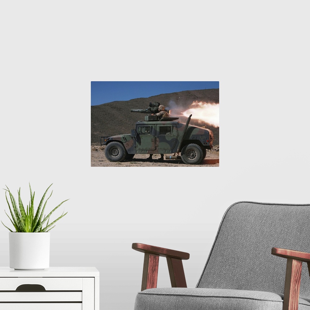 A modern room featuring An antitank missileman fires off a BGM-71 Tube-launched Optically-tracked Wire-guided missile (TO...
