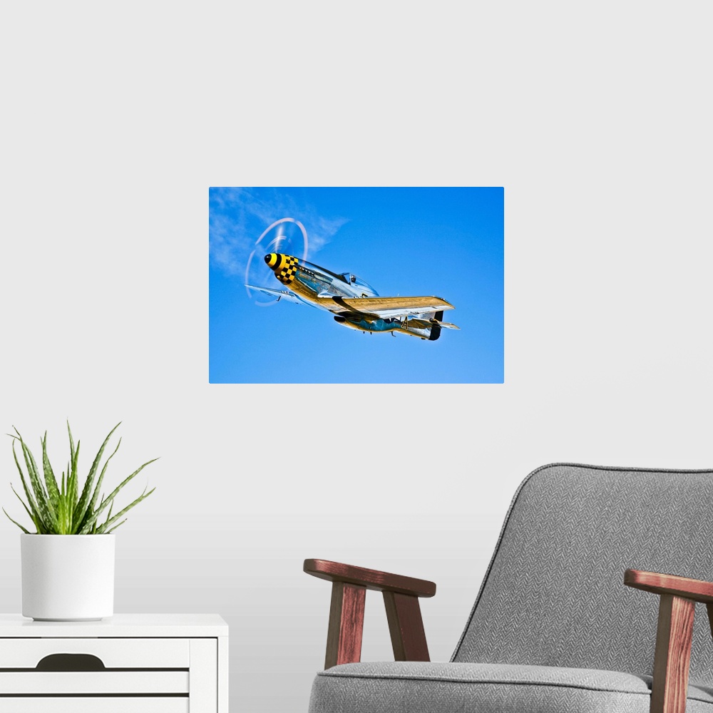 A modern room featuring A North American P-51D Mustang in flight near Chino, California.