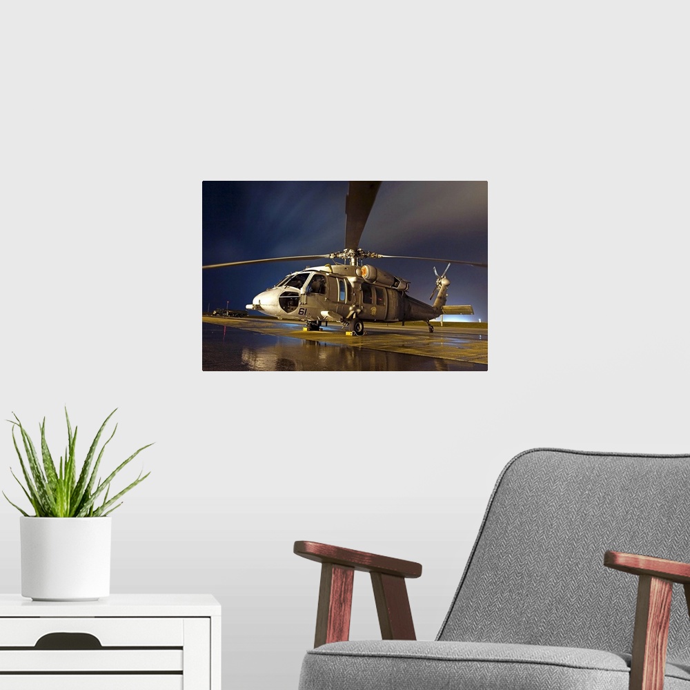 A modern room featuring A US Navy MH60S Seahawk helicopter